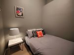 Queen size bed in the semi-private den bedroom no door
